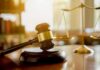 Family’s Grief Echoes After Halloween Slaying Judge's gavel on a block with scales of justice in the background