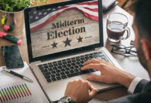 The Midterms Could Reshape Power Beyond Election Night Person using laptop displaying midterm election screen
