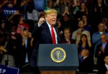 Five-Grand Frenzy – Real Or Mirage? Donald Trump speaking at a rally behind a presidential podium