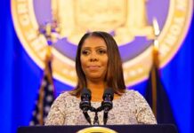 Woman speaking at podium with microphones