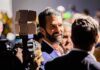 Donald Trump Jr. smiling in a crowd at an event