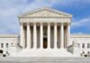 Licenses, Contracts, Conscience – Who Loses? Front view of the Supreme Court building with large columns and steps under a blue sky