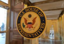 U.S. House of Representatives seal on a glass door