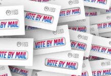 Envelopes with vote by mail windows stacked in a collage