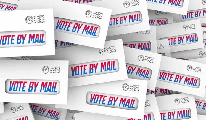 shutterstock_1799810800 Envelopes with vote by mail windows stacked in a collage