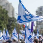 Political Survival Hangfire In Israel Israeli flags waved at a street demonstration