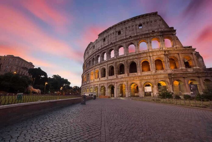 shutterstock_400700293 Colosseum exterior at sunset with glowing arches