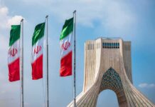 Shock Visit: Riyadh Walks Into Tehran Iranian flags beside Azadi Tower in Tehran