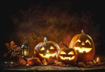 Halloween Display Sparks Lynching Uproar Jack-o'-lantern pumpkins glowing on a rustic table